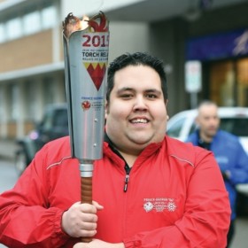 Tim running the 2015 Canada Winter Games Torch Relay