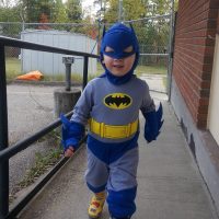 Tim's son dressed as Batman