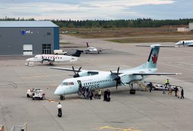 Passengers boarding a plane at the Prince George Airport