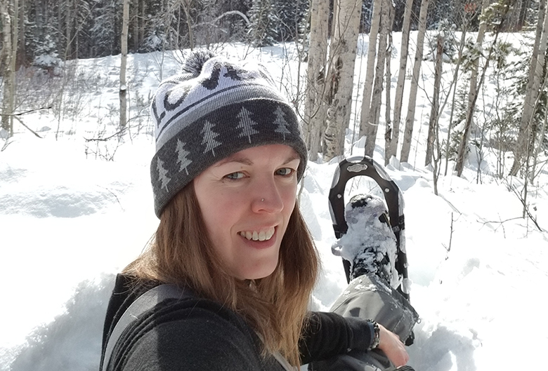 Jessica snowshoeing in her backyard