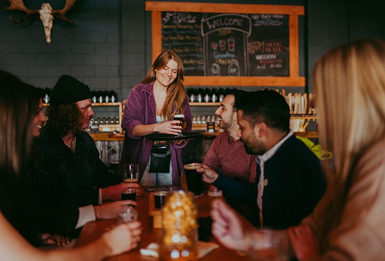 People drinking at a brewery