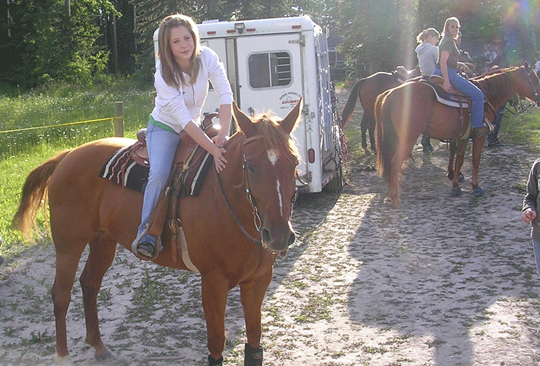 Girl horseback riding