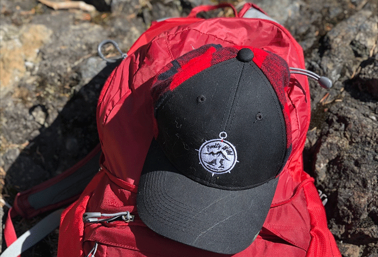 Hat on hiking bag